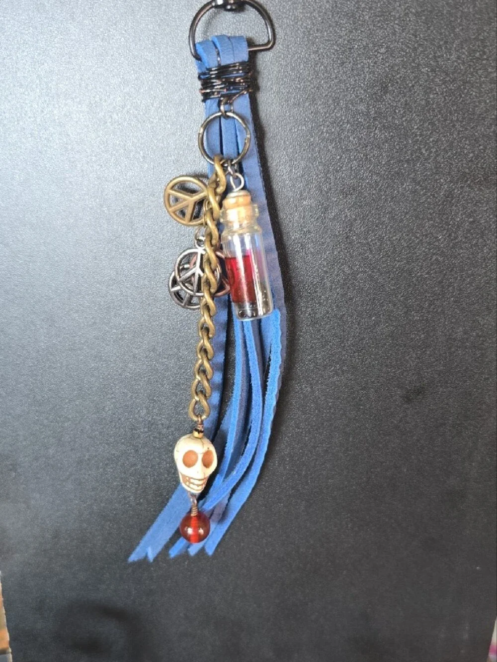Blue Tassel Keychain with Skull and Charm Accents